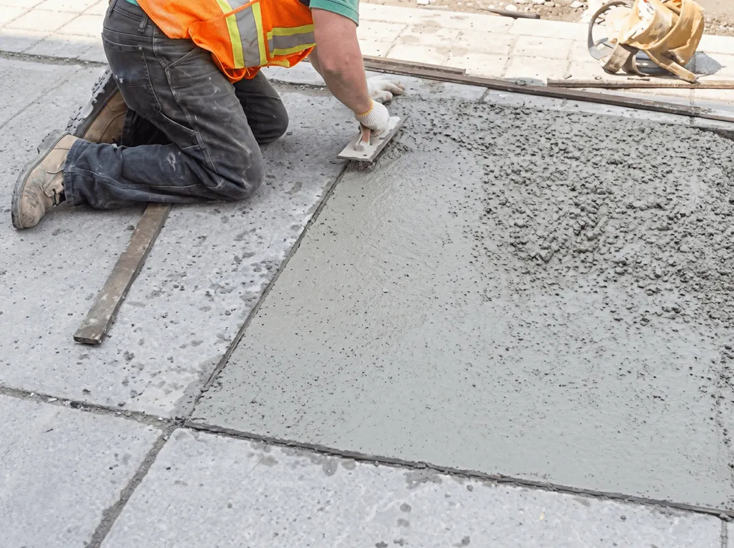 Professional repairing a concrete floor in Boca Raton, FL